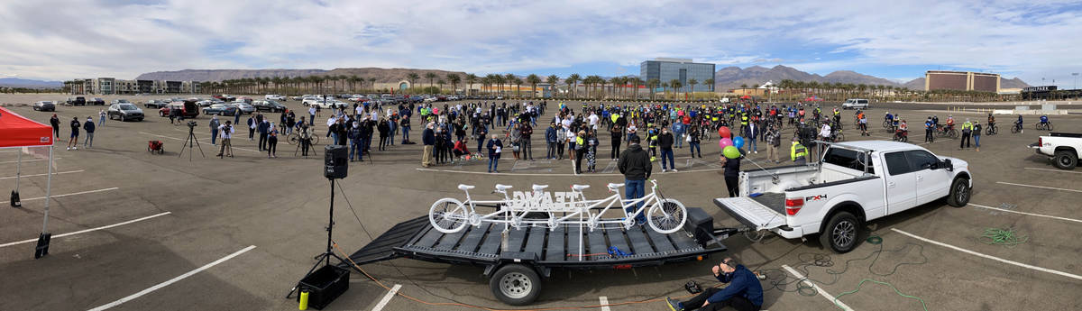 Panoramic as friends and family gather about the Ghost Bike to honor the five cyclists recently ...