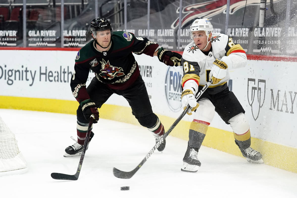 Vegas Golden Knights center Jonathan Marchessault (81) centers the puck in front of Arizona Coy ...