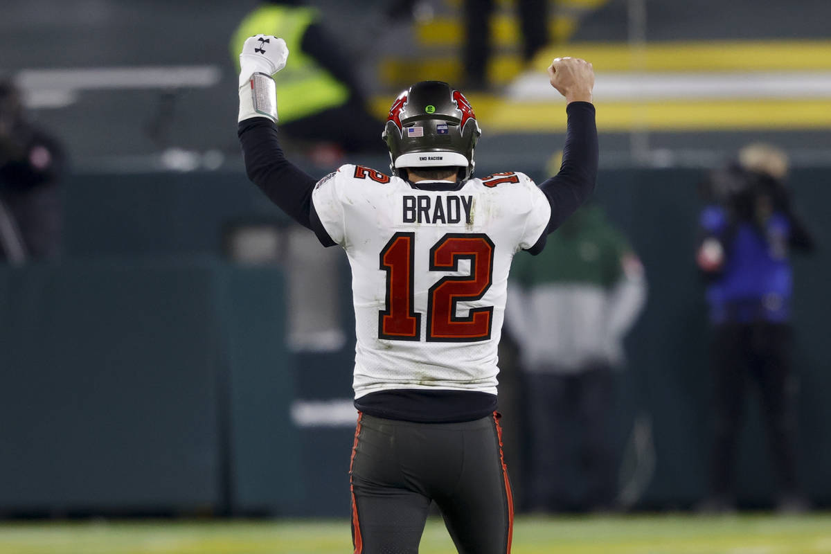 Tampa Bay Buccaneers quarterback Tom Brady reacts after winning the NFC championship NFL footba ...