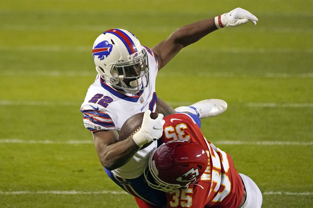 Buffalo Bills running back T.J. Yeldon is tackled by Kansas City Chiefs cornerback Charvarius W ...