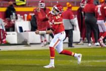 Kansas City Chiefs quarterback Patrick Mahomes celebrates after throwing a 5-yard touchdown pas ...