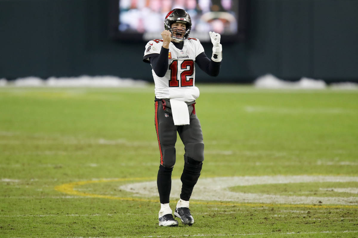 Tampa Bay Buccaneers quarterback Tom Brady reacts after winning the NFC championship NFL footba ...