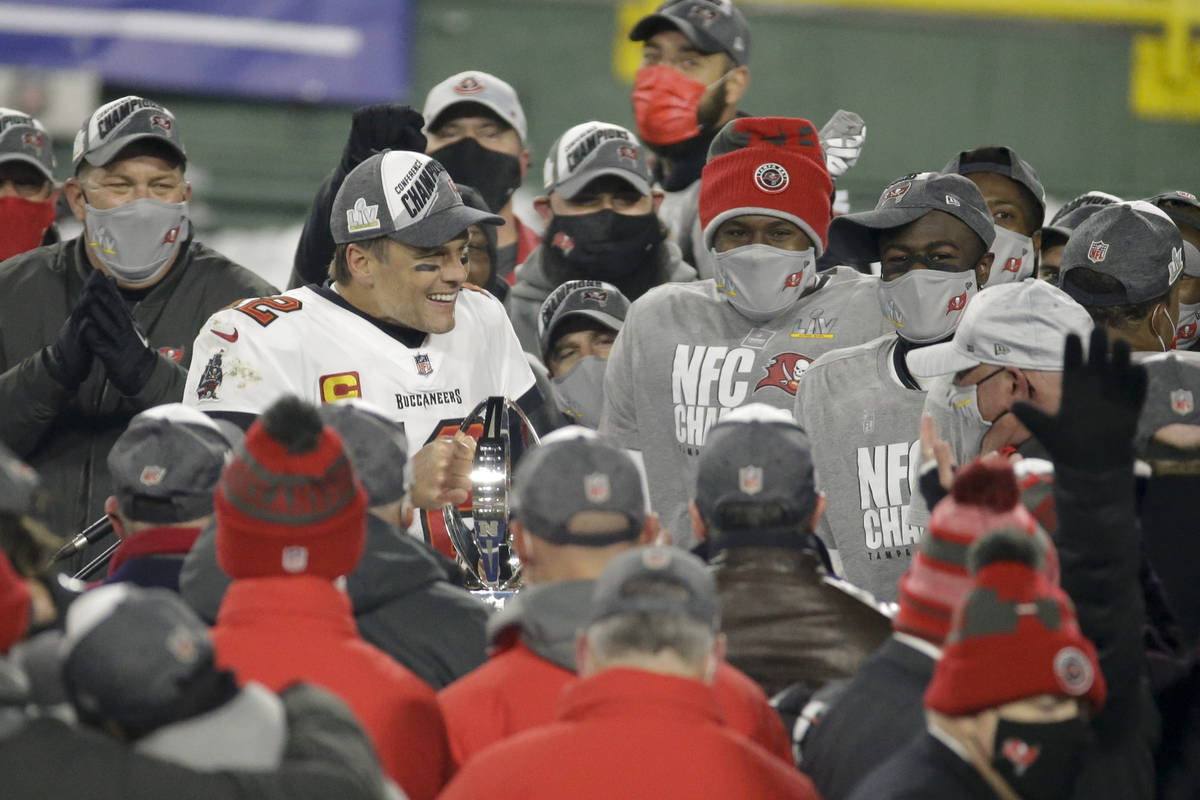 Tampa Bay Buccaneers quarterback Tom Brady (12) holds the championship trophy after winning the ...