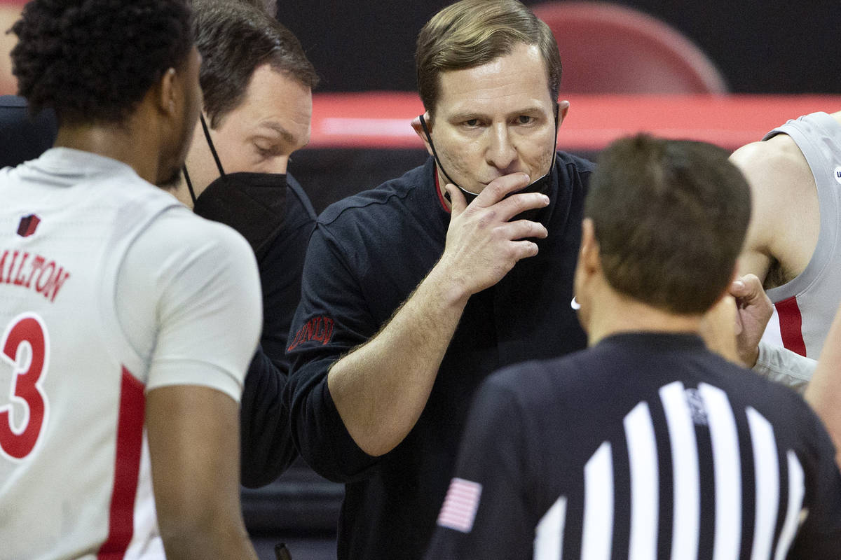 UNLV's head coach T. J. Otzelberger communicates with a referee during the second half of a bas ...