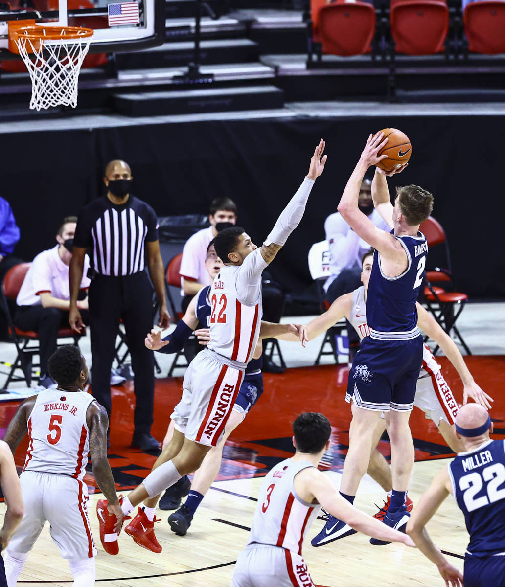 UNLV Rebels guard Nicquel Blake (22) tries to block a shot from Utah State Aggies guard Sean Ba ...