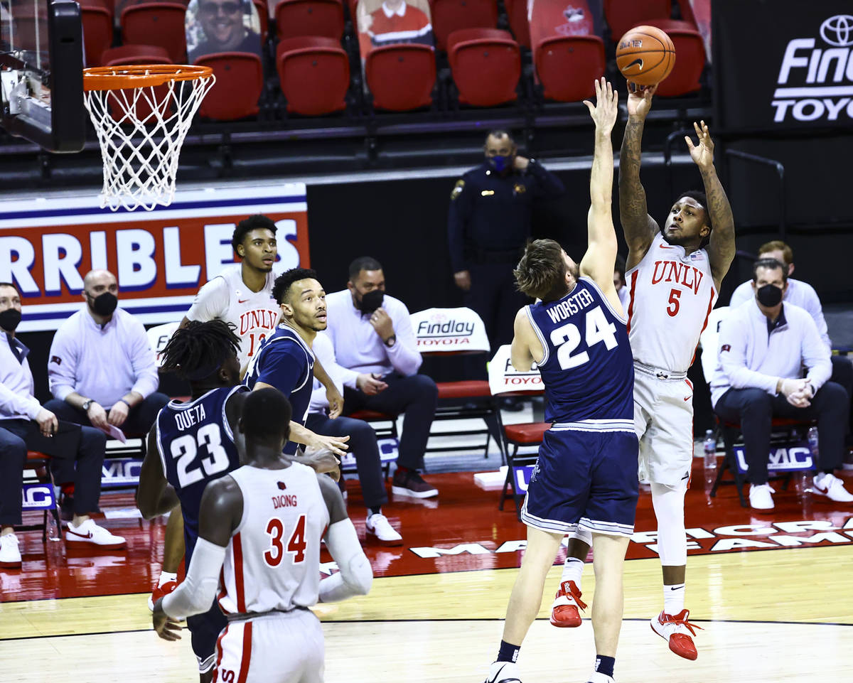 UNLV Rebels guard David Jenkins Jr. (5) shoots over Utah State Aggies guard Rollie Worster (24) ...