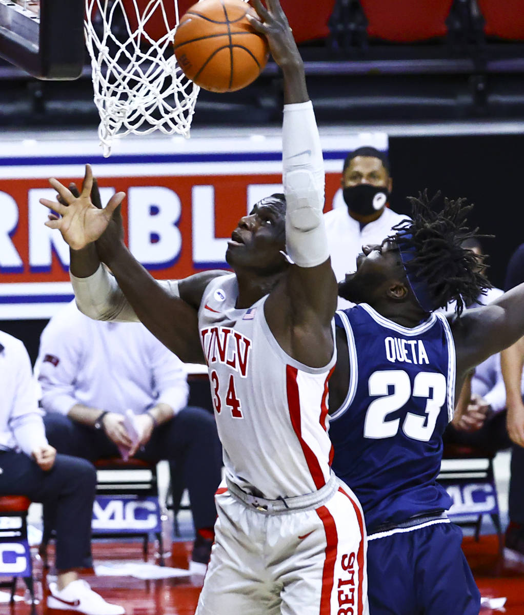 UNLV Rebels forward Cheikh Mbacke Diong (34) goes to the basket against Utah State Aggies cente ...