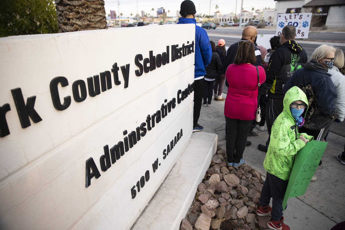J. Adams, 8, protests Clark County School District's decision to cancel winter and fall sports ...