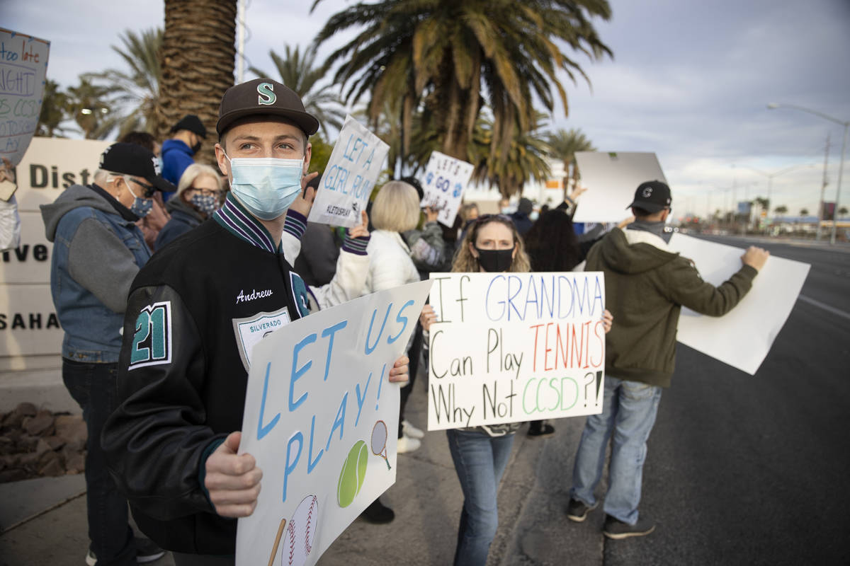 Andrew Maxwell, 18, a senior at Silverado High School, with his mother Staci, protest Clark Cou ...