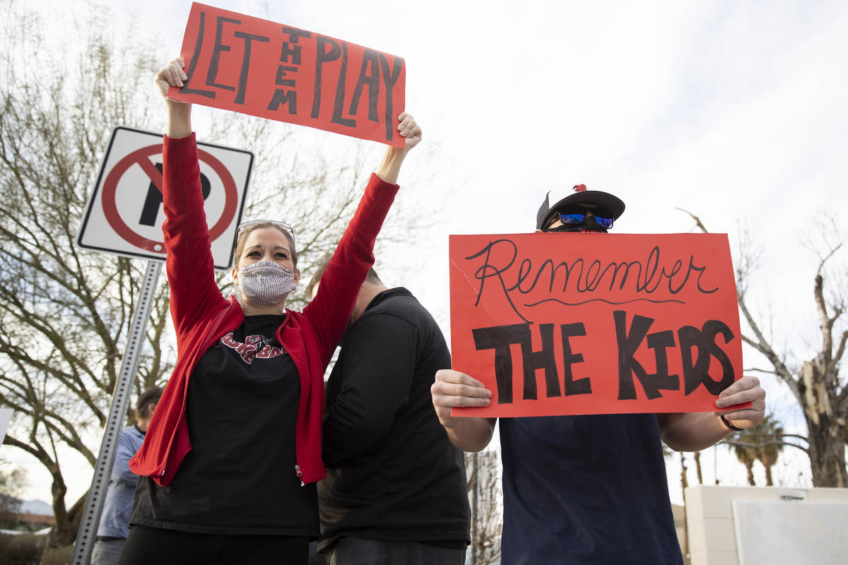 Gretchen Free and her son Jordan 18, a wrestler at Lincoln County High School, protest Clark Co ...