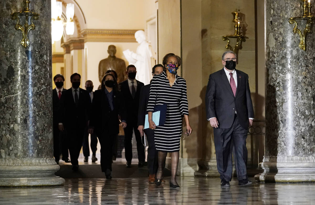 Clerk of the House Cheryl Johnson along with acting House Sergeant-at-Arms Tim Blodgett, lead t ...