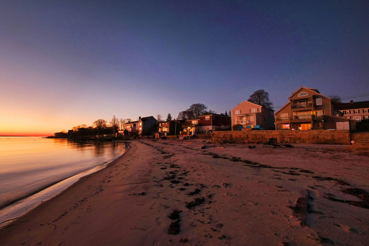 The early morning sun lights up the home at 500 Pequot Ave, right, along the Thames River, pict ...