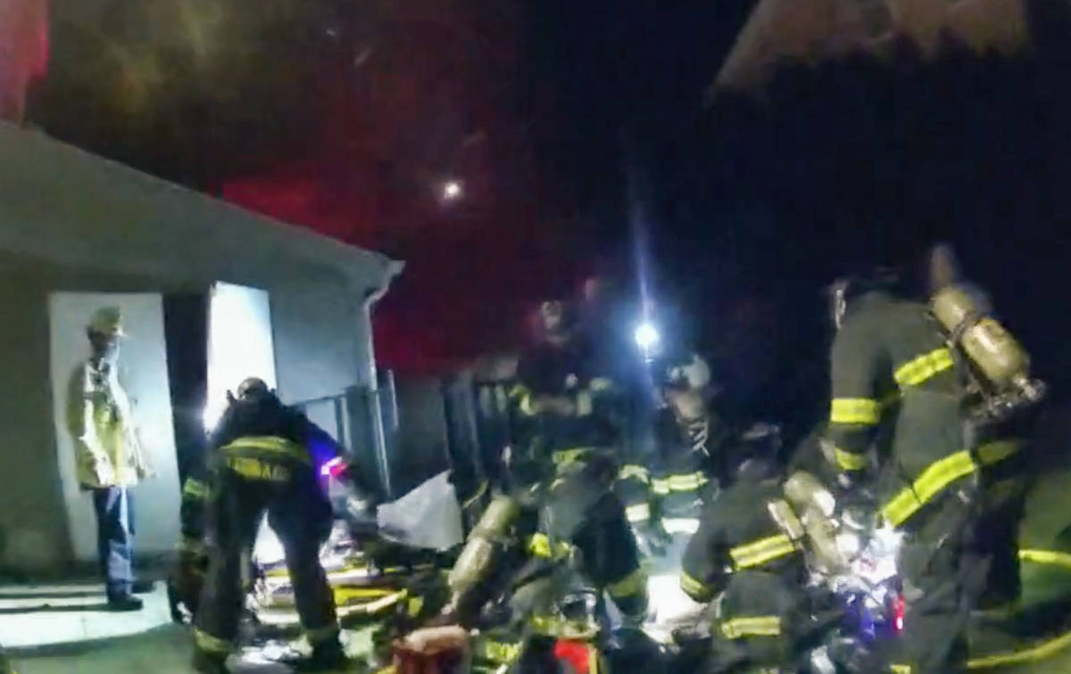 This frame grab from video provided by the New London Police Department shows firefighters res ...