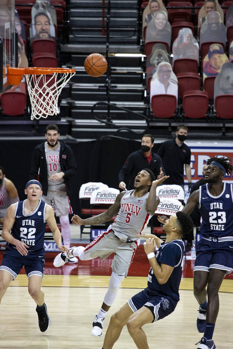 UNLV's guard David Jenkins Jr. (5) makes a point during the second half of a basketball game ag ...