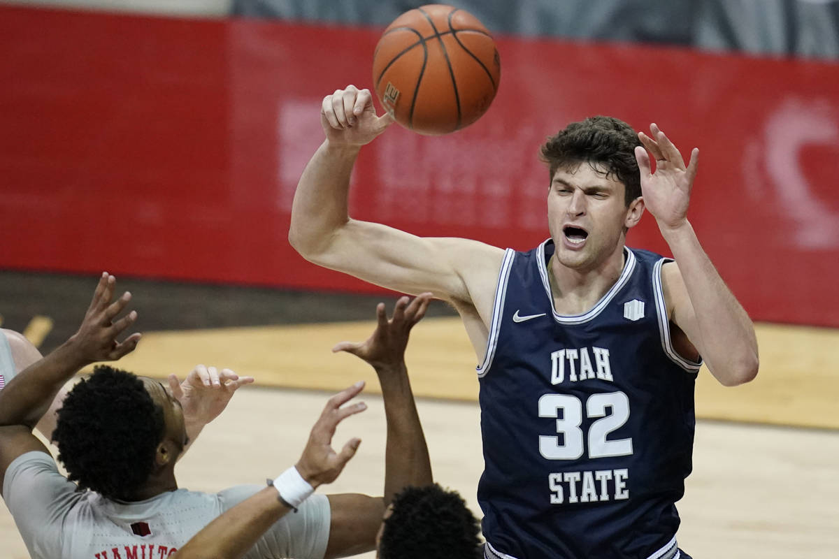 Utah State's Trevin Dorius (32) grabs a rebound over UNLV during the first  half of an NCAA coll … | Las Vegas Review-Journal