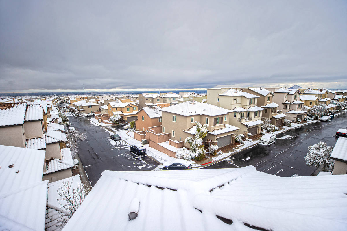 Snow covers the rooftops of homes in northwest Las Vegas on Tuesday, Jan. 26, 2021. (Benjamin H ...