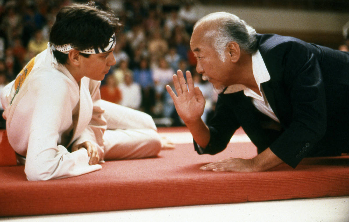 Ralph Macchio, left, and Pat Morita in a scene from "The Karate Kid." (Sony Pictures Entertainment)