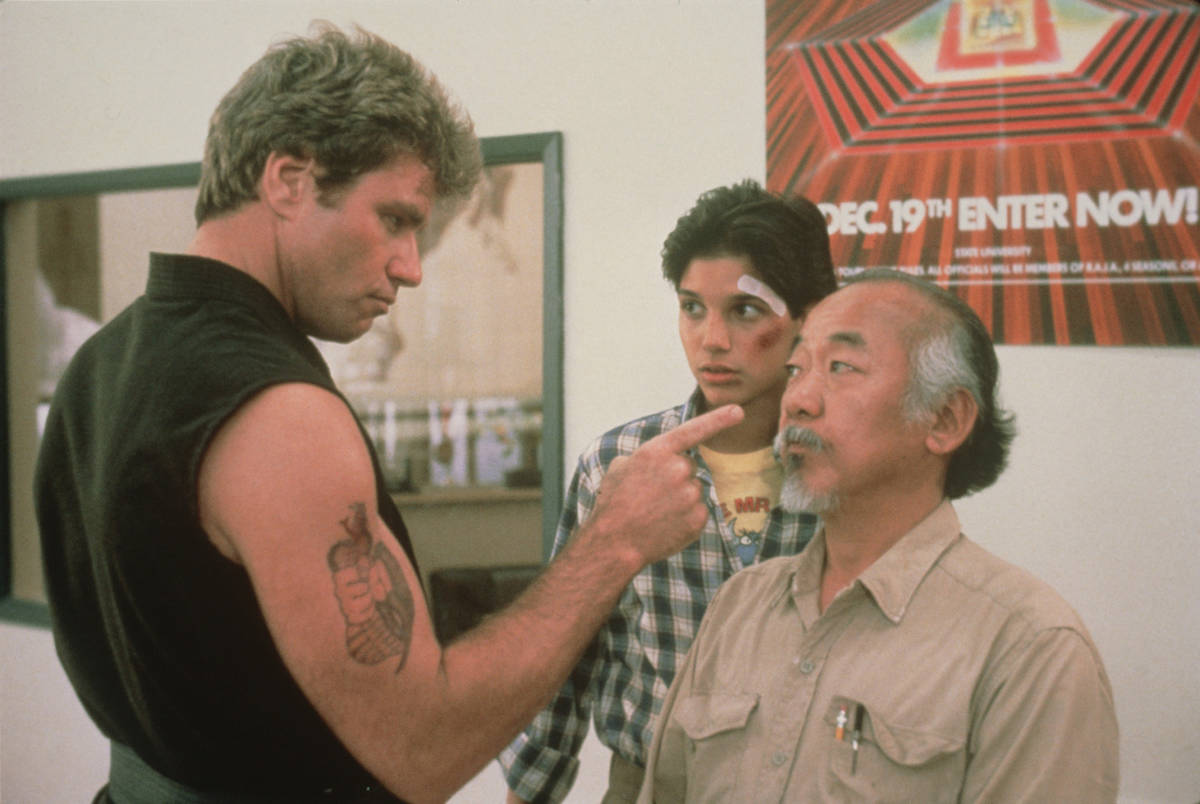 Martin Kove, from left, Ralph Macchio and Pat Morita in "The Karate Kid." (Sony Pictures Entert ...