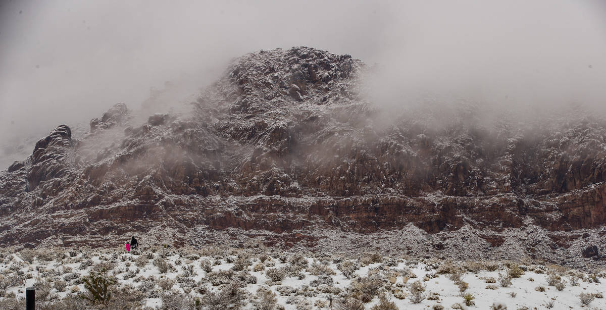 People play in the snow about Calico Basin in the Red Rock Conservation Area on Tuesday, Jan. 2 ...