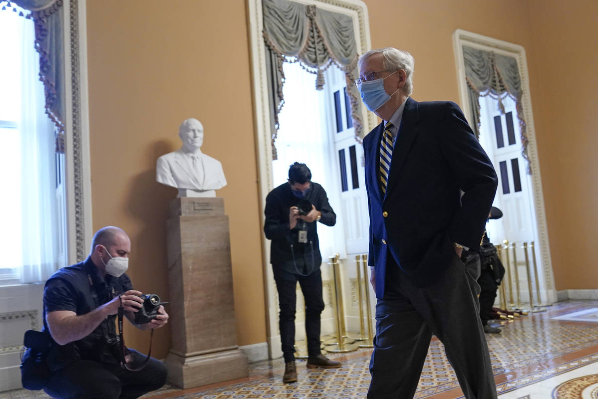 Senate Minority Leader Mitch McConnell of Ky., walks to his office on Capitol Hill in Washingto ...
