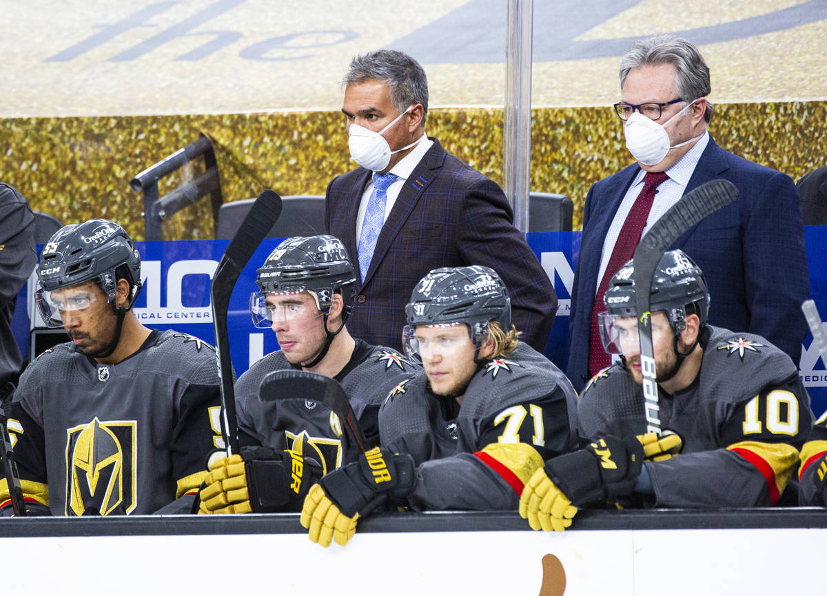 Silver Knights head coach Manny Viveiros, center left, and Golden Knights general manager Kelly ...