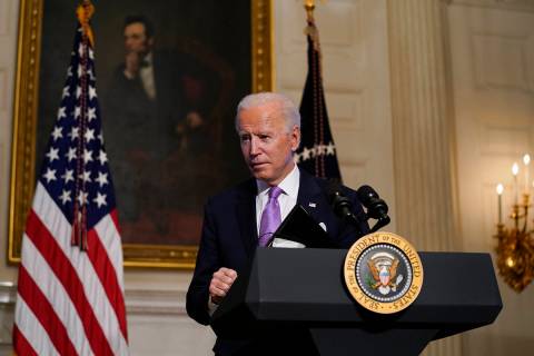 President Joe Biden leaves after delivering remarks on COVID-19, in the State Dining Room of th ...