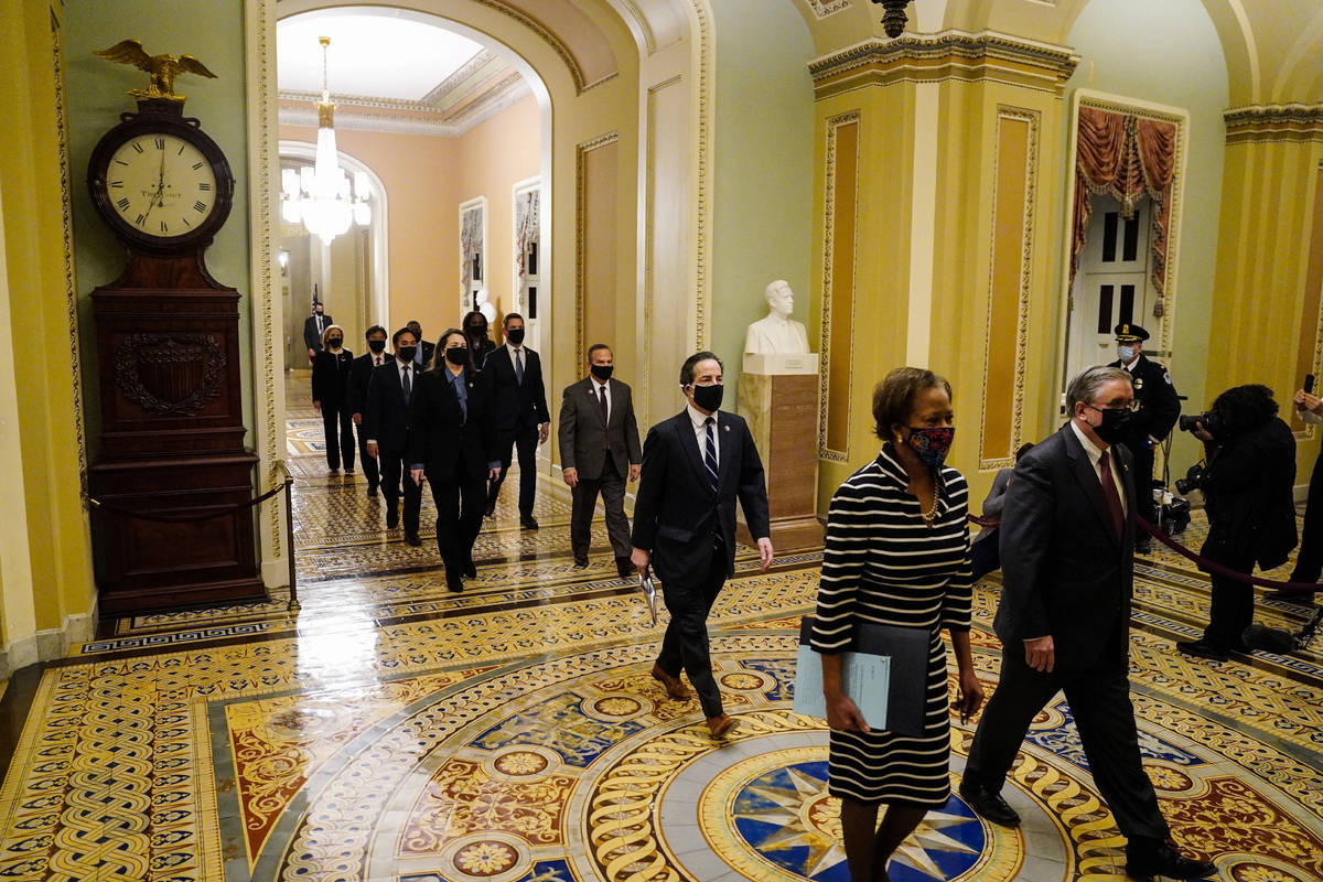 Clerk of the House Cheryl Johnson along with acting House Sergeant-at-Arms Tim Blodgett lead th ...