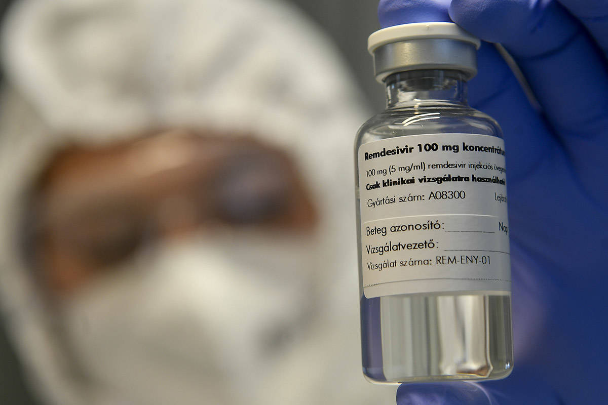 A bottle containing the drug Remdesivir is held by a health worker in Debrecen, Hungary. (Zsolt ...