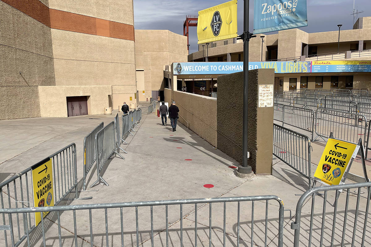 People arrive for COVID-19 vaccines at Cashman Center in Las Vegas Wednesday, Jan. 26, 2021. (K ...