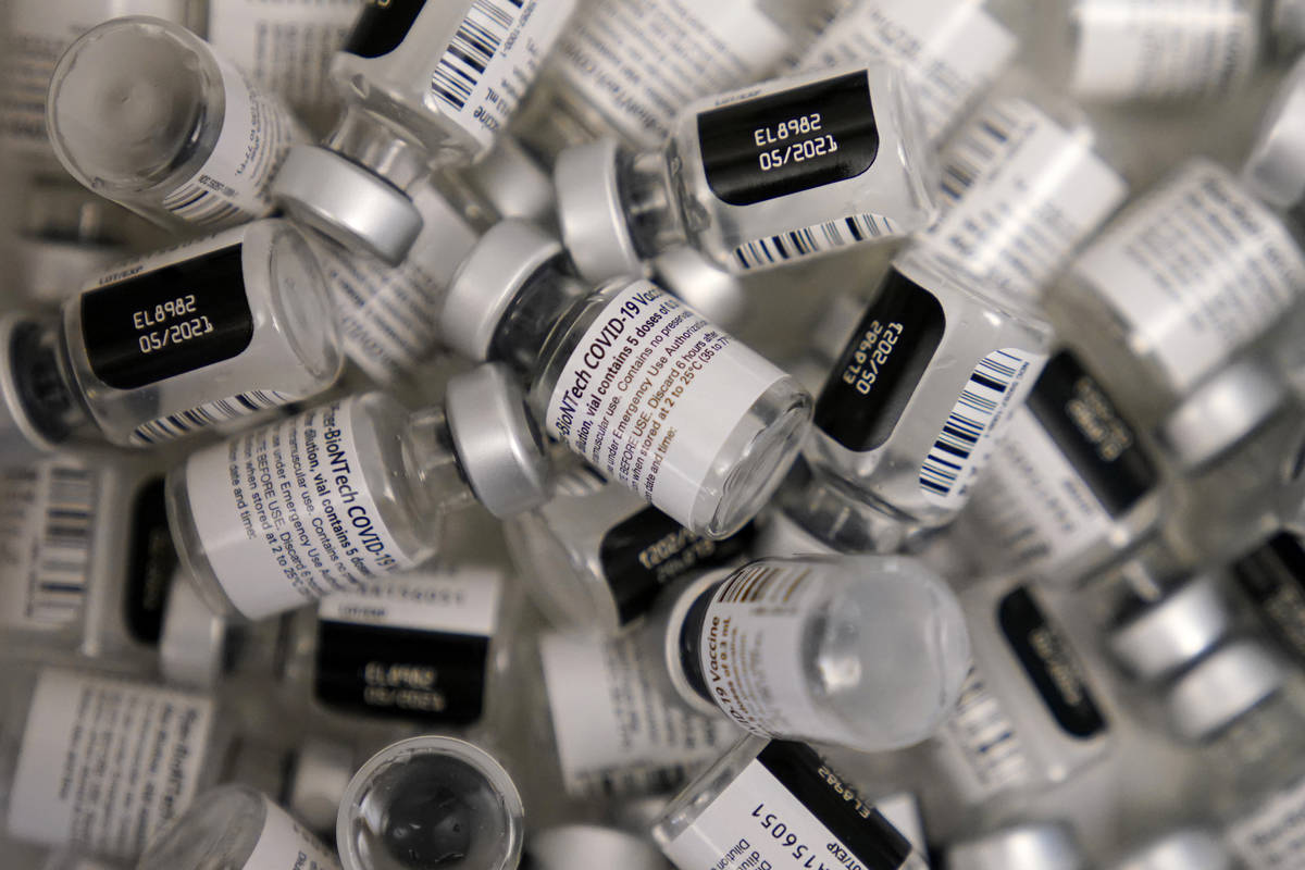 n this Friday, Jan. 22, 2021 file photo, empty vials of the Pfizer-BioNTech COVID-19 vaccine ar ...