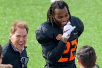 National Team running back Najee Harris of Alabama (22) laughs with Alabama head coach Nick Sab ...