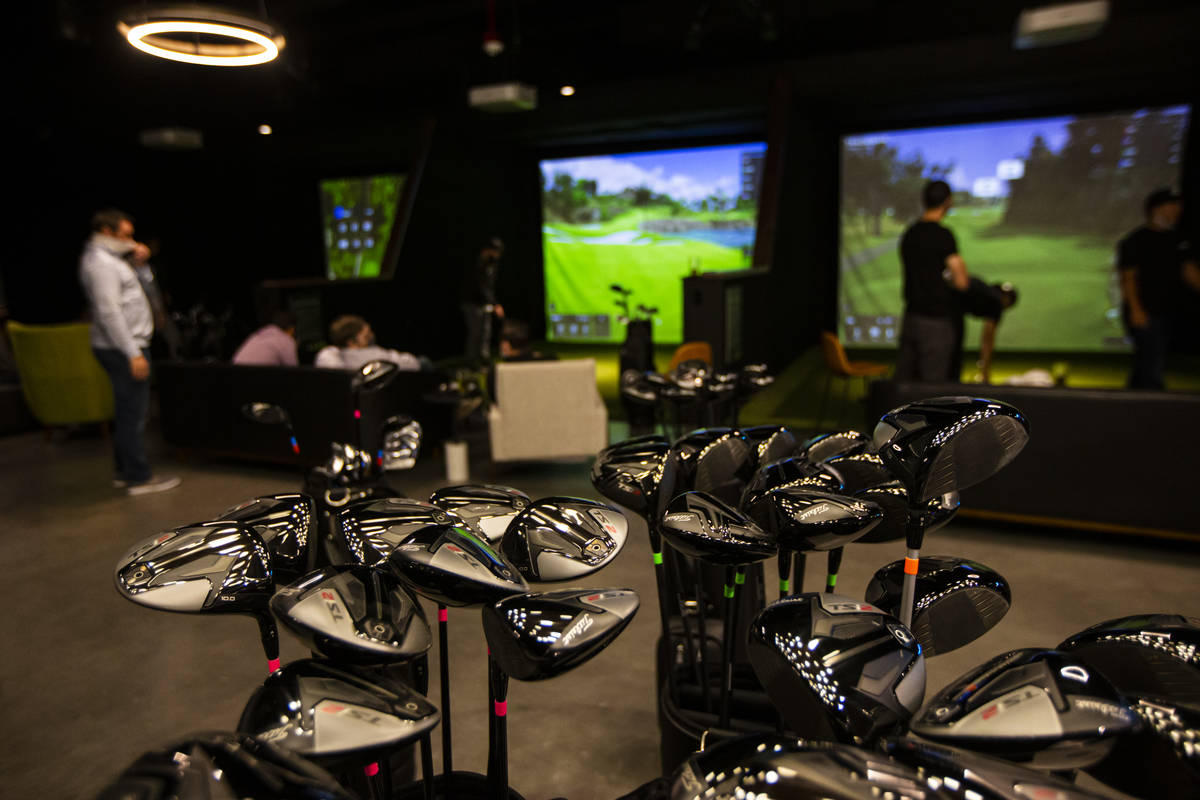Golf clubs are seen during a friends and family event at Five Iron Golf at Area15 in Las Vegas ...