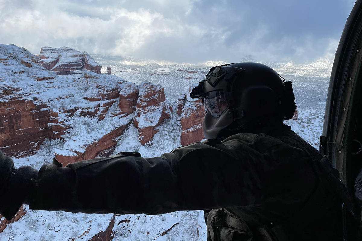 This photo provided by the Arizona National Guard shows a UH-60 Black Hawk crew with the Arizon ...