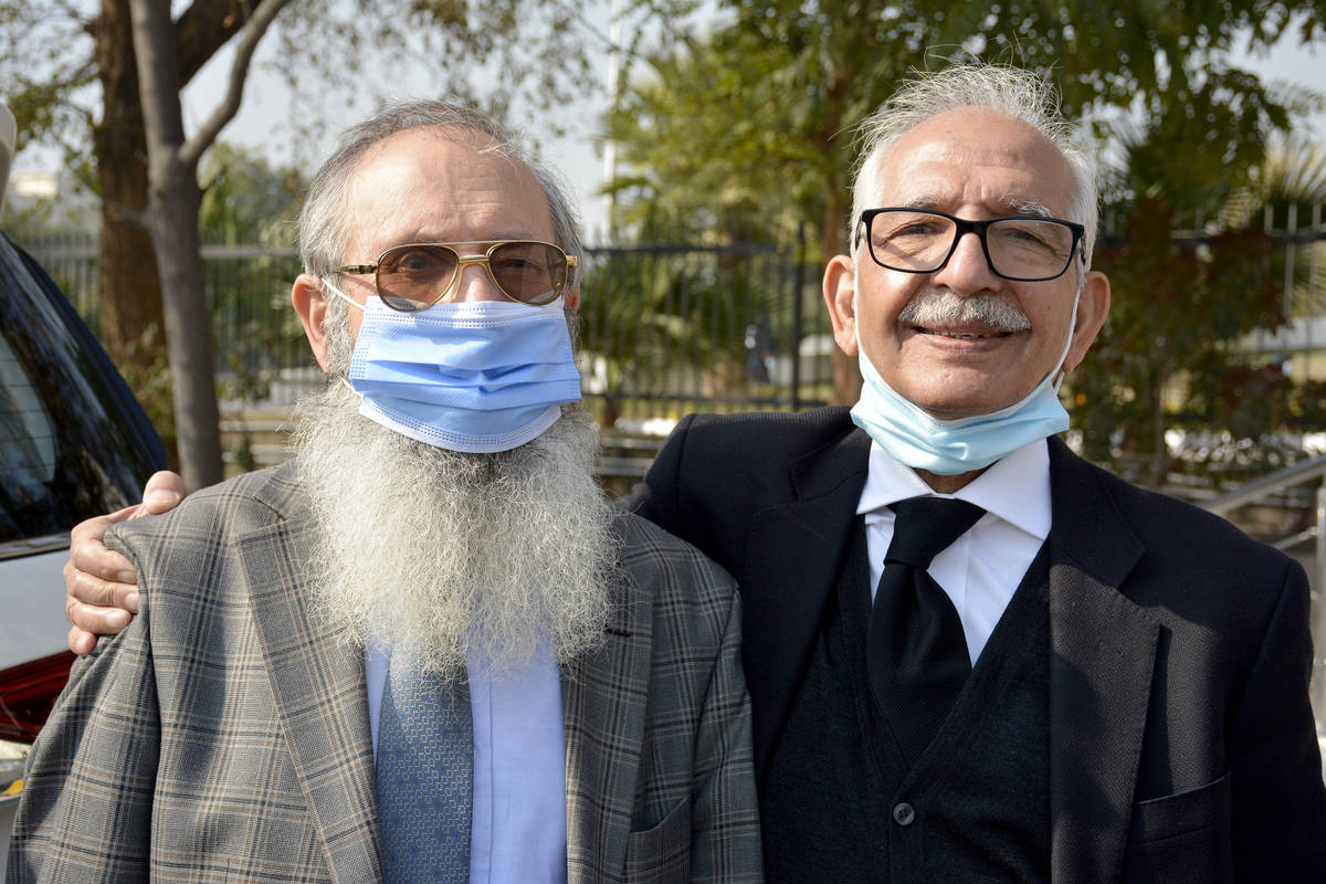 Mehmood A. Sheikh, right, defense lawyer, and Ahmed Saeed Sheikh, father of British-born Pakist ...