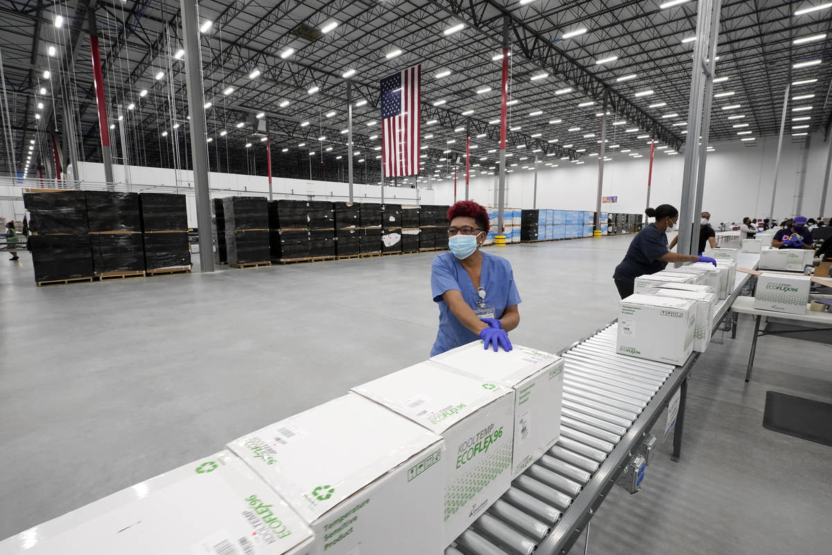 FILE - In this Sunday, Dec. 20, 2020 file photo, boxes containing the Moderna COVID-19 vaccine ...