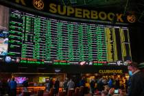 The Westgate sportsbook posts hundreds of Super Bowl prop bets and the line of bettors forms on ...