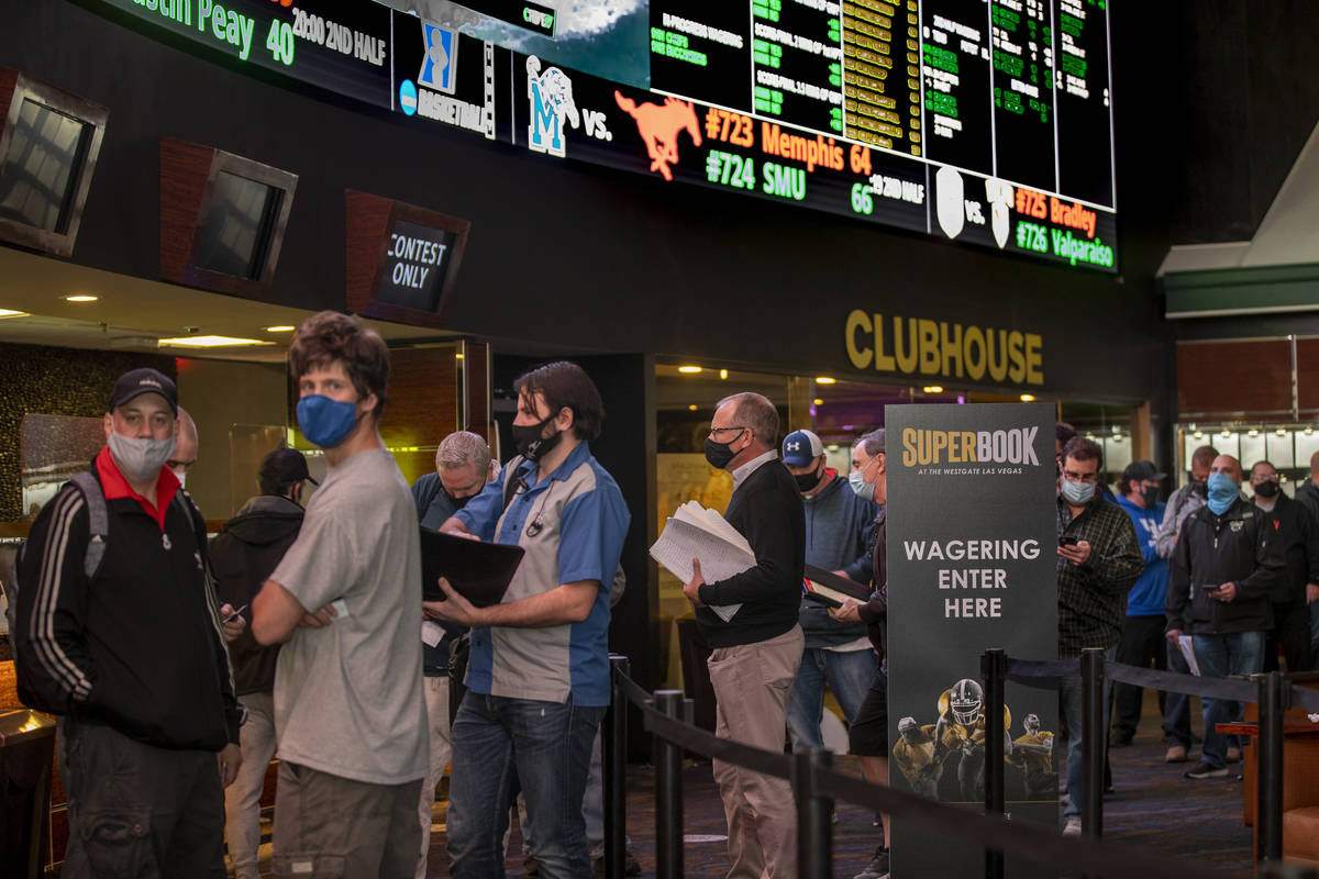 Bettors wait in line as the Westgate sportsbook posts hundreds of Super Bowl prop bets on Thurs ...