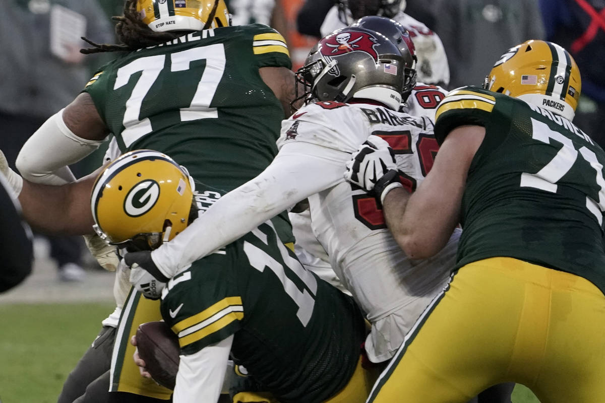 Tampa Bay Buccaneers' Shaquil Barrett (58) sacks Green Bay Packers quarterback Aaron Rodgers (1 ...