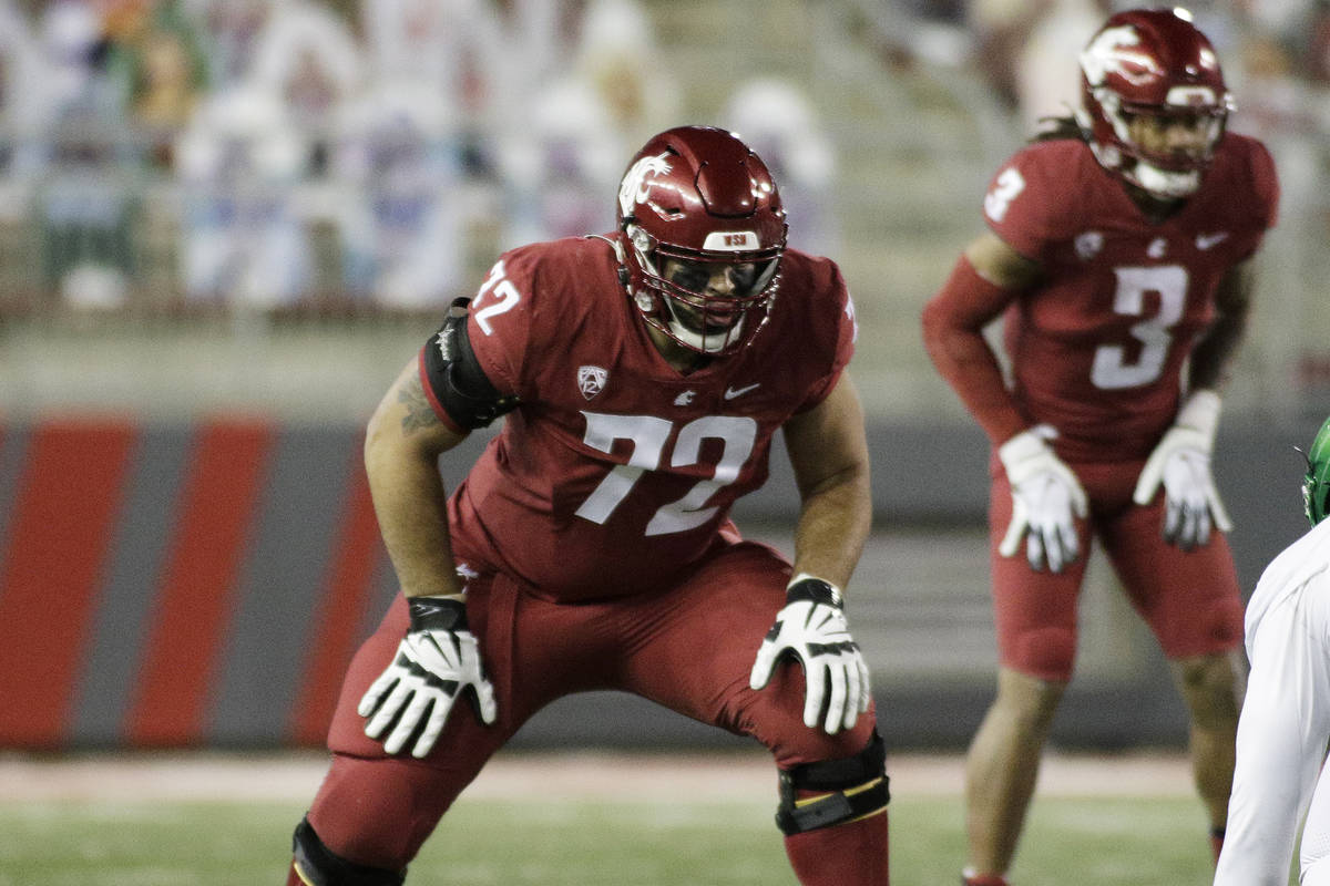 Washington State offensive lineman Abraham Lucas (72) lines up for a play during the first half ...