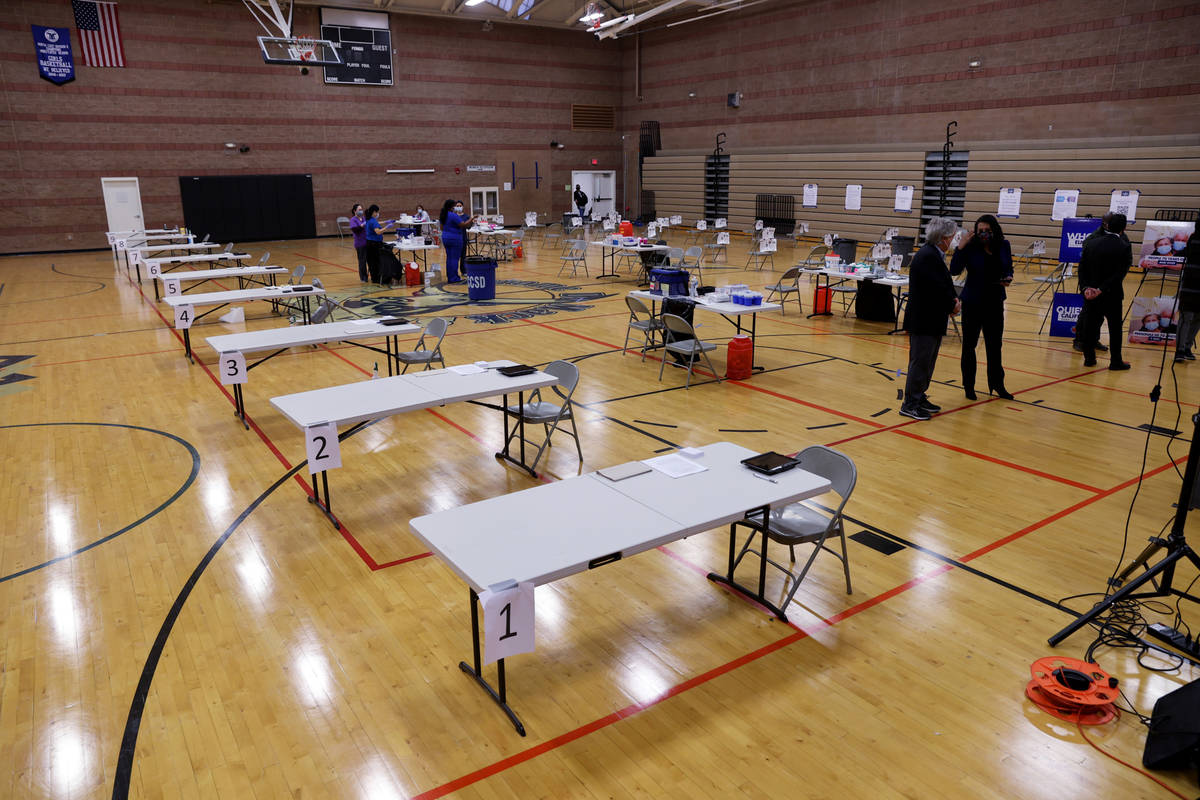 Southern Nevada Health District officials prepare for a COVID-19 pop-up vaccination clinic at M ...