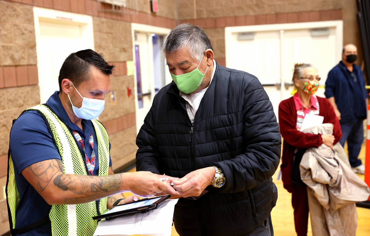 Bobby Donnell, left, an environmental health specialist with Southern Nevada Health District, c ...