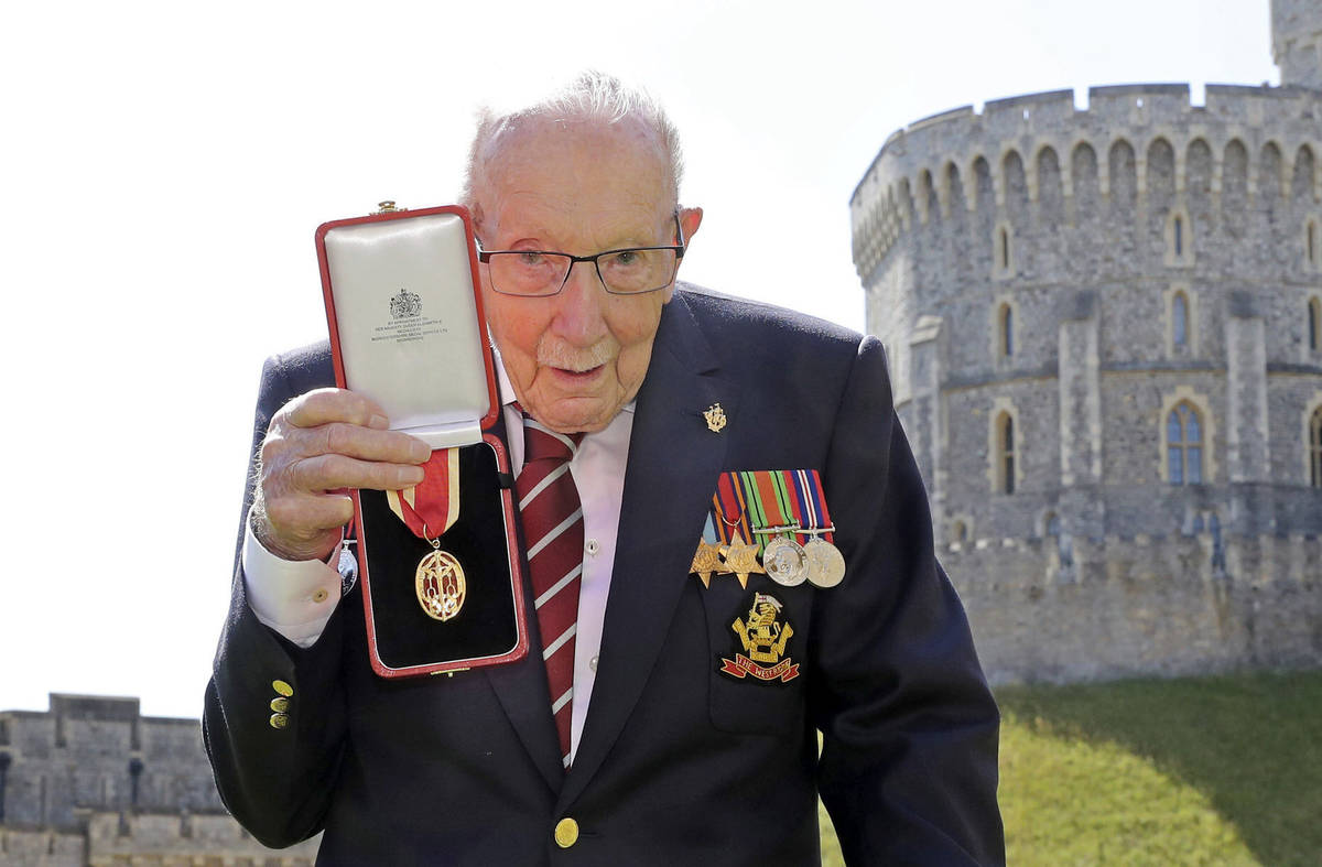 FILE - In this Friday, July 17, 2020 file photo, Captain Sir Thomas Moore poses for the media a ...