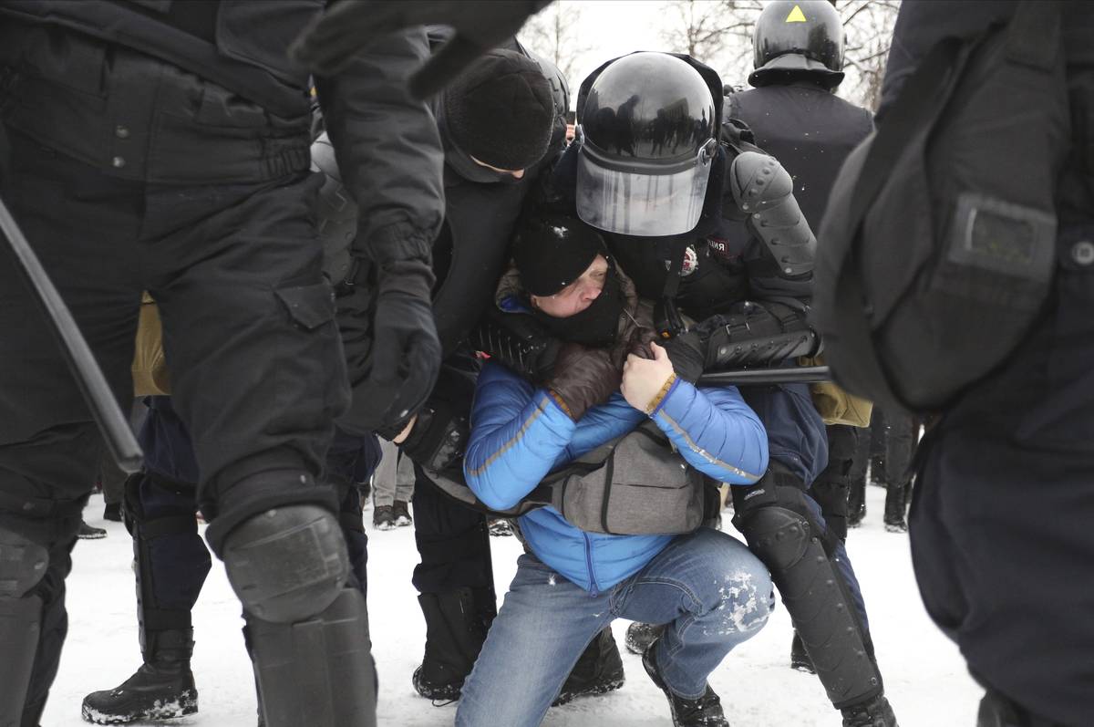 Police detain protesters during a protest against the jailing of opposition leader Alexei Naval ...