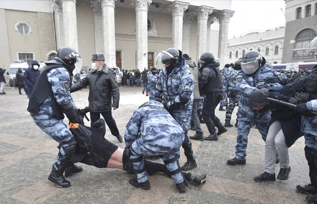 Police detain protesters during a protest against the jailing of opposition leader Alexei Naval ...