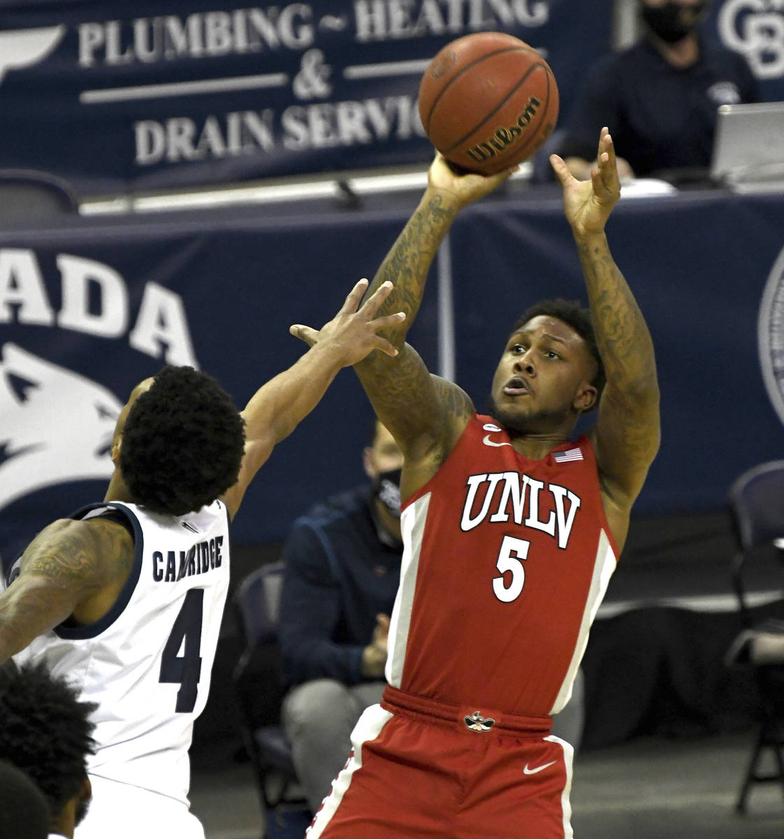 UNLV's David Jenkins shoots aganst UNR's Desmond Cambridge, Jr. in the first half of an NCAA co ...