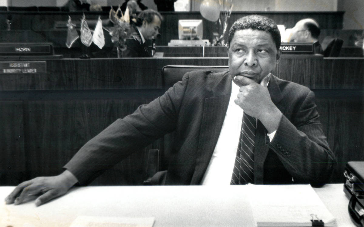 Nevada state Sen. Joe Neal sits in his chair during a recess in the Senate chambers in 1989. ( ...