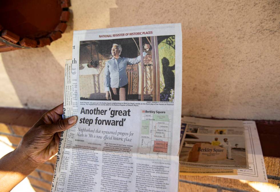 Ruth Eppenger-D'Hondt shows an article about her work and accomplishments in the Berkley Square ...