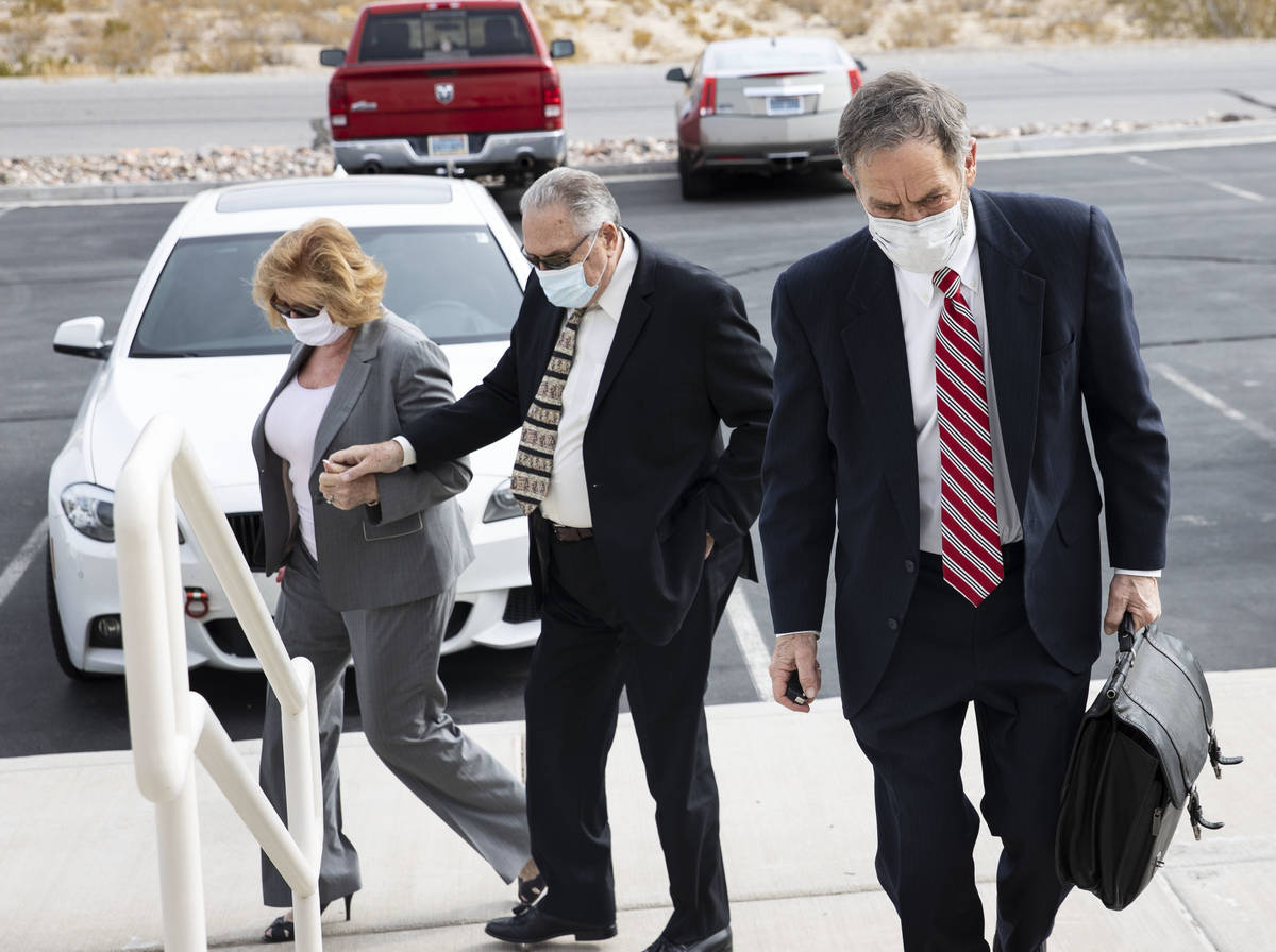 Patricia, left, and her husband Marcel Chappuis arrive with their attorney Thomas Gibson, right ...