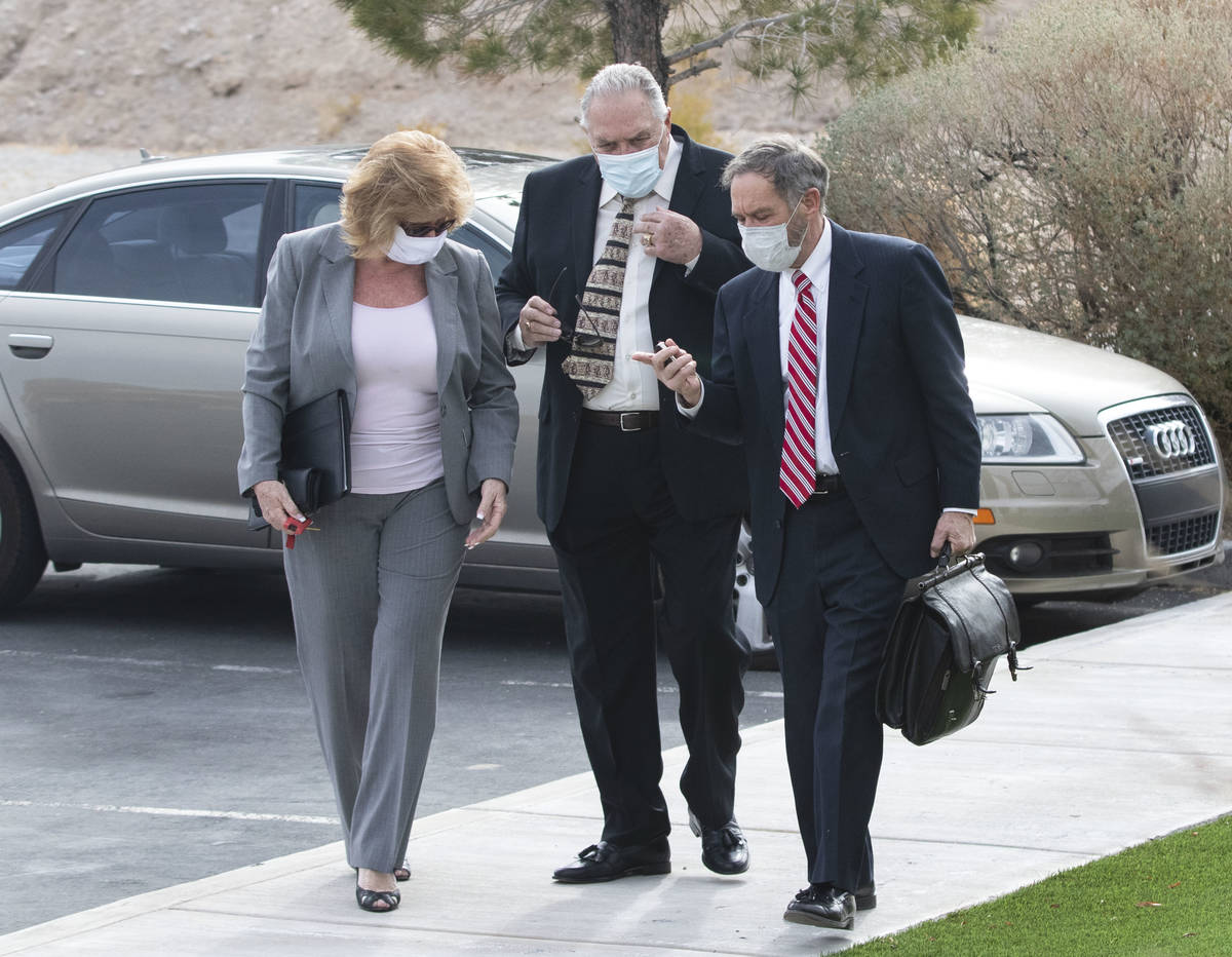 Patricia, left, and her husband Marcel Chappuis arrive with their attorney Thomas Gibson, right ...