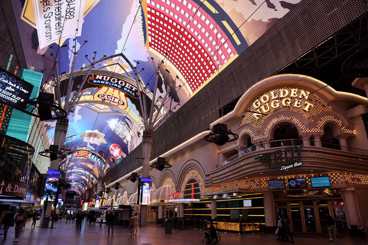 Golden Nugget historical images are shown on the canopy at the Fremont Street Experience in dow ...